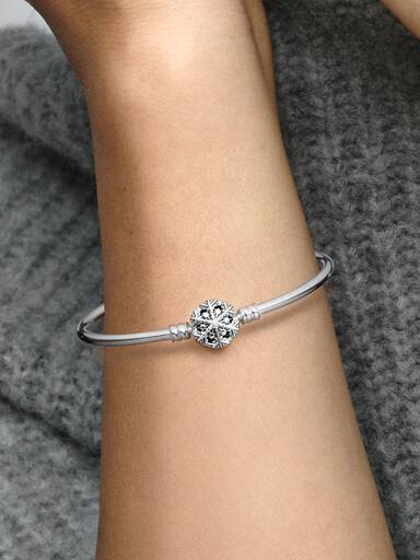 Sterling silver bangle with snowflake clasp and clear cubic zirconia