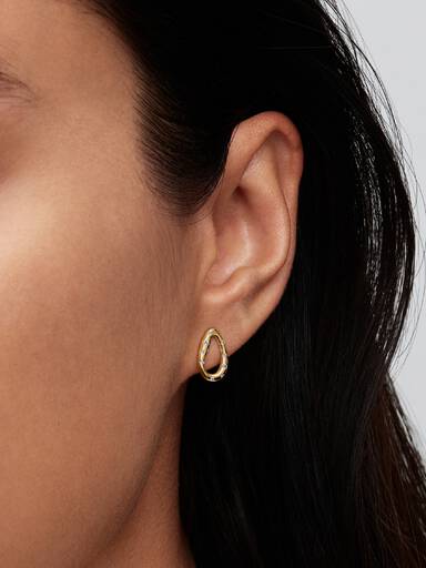 Aretes de botón con forma oval orgánica engastados con piedras
